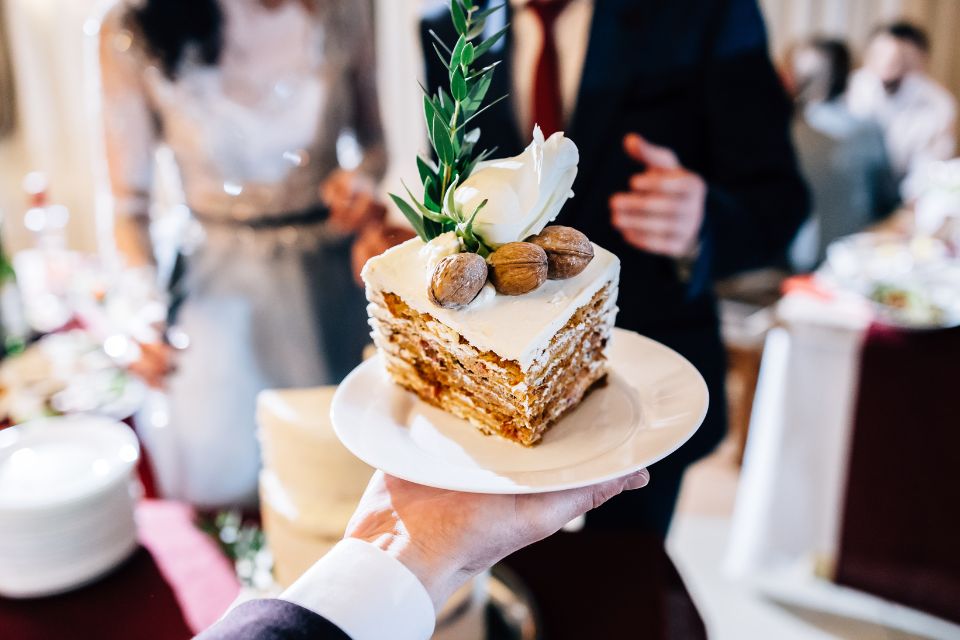 A Greek wedding cake displayed on a plate as part of a Greek wedding tradition